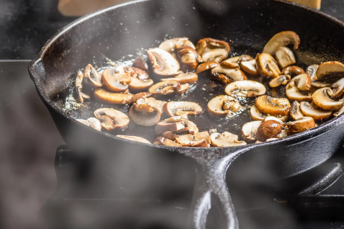 Sautéing Chicken of the Woods in a skillet.